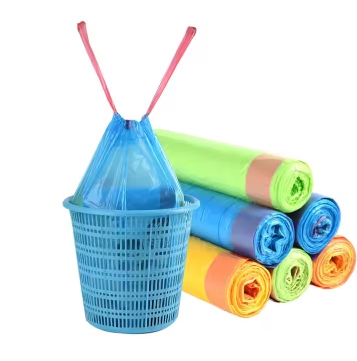 Multi-colored drawstring trash bag roll
