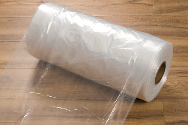Transparent unprinted packaging roll (with folded edges and triangular dotted lines)