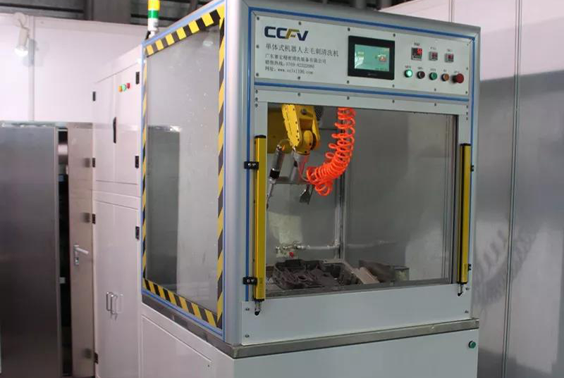 Monolithic robot deburring cleaning machine