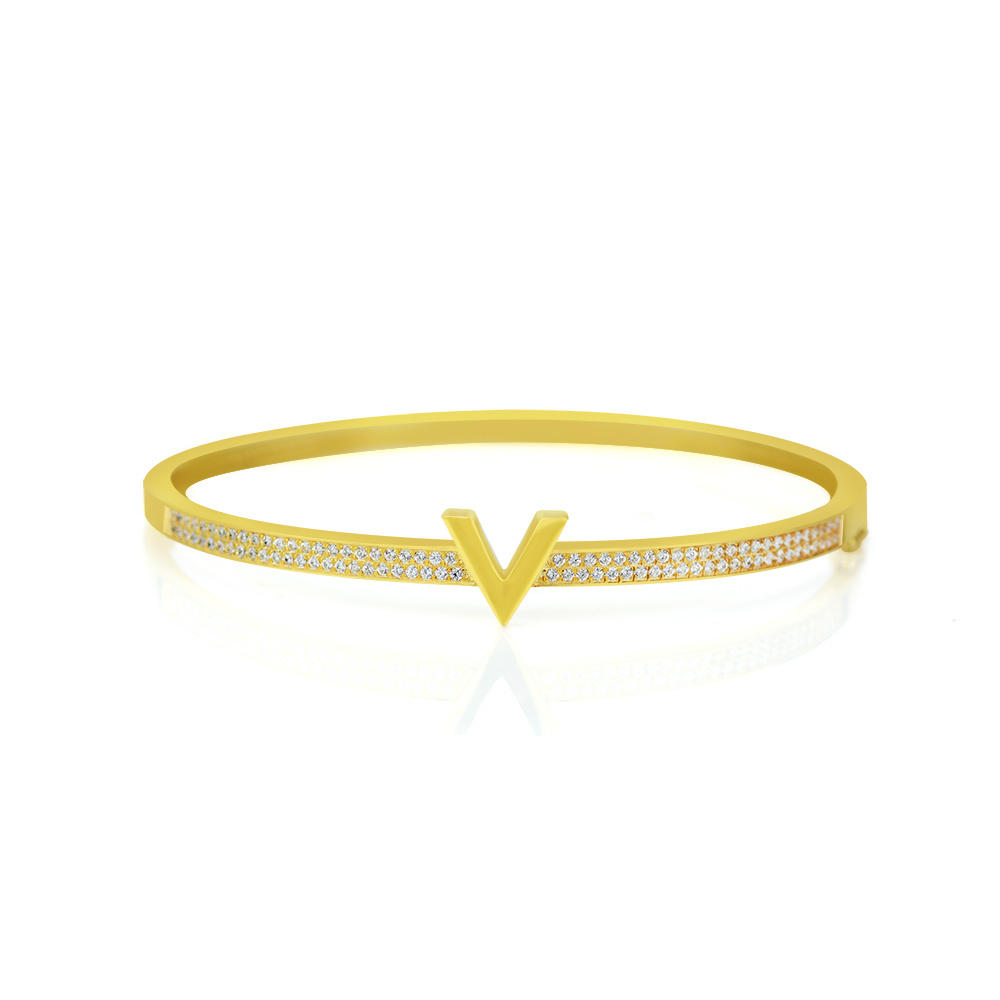 Bangle a forma di V in oro giallo 18 carati con zirconi